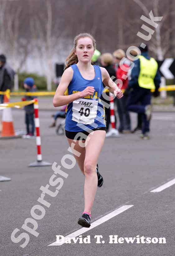 Lydia Turner (Birtley) finishing the first leg in third place, senior womens Elswick Road Relays.